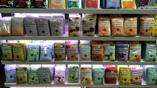 Outside beauty shops you see booths with lots of beauty face masks.