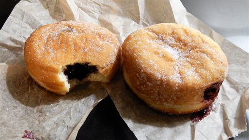 Donuts filled with blackcurrant jam.