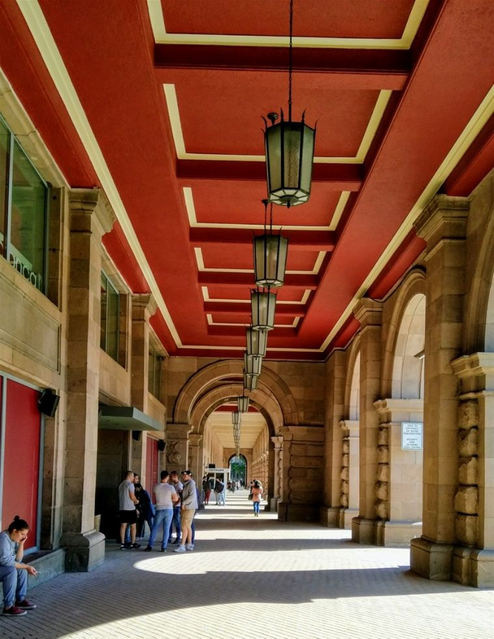 The TSUM arcade, the Largo. TSUM opened in 1957 as a people's department store.  Today it is transformed to become a place for expensive boutiques.  Even though the rents are very high, the store looks gloomy and neglected.
