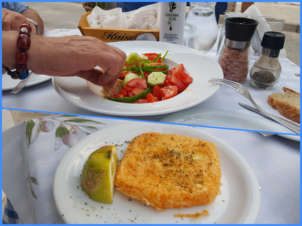 Alektor restaurant.  Tomato/cucumber salad and saganaki cheese.