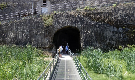 From the boathouses a metal bridge takes you to a subterranean path (exit) out to the cafe area.