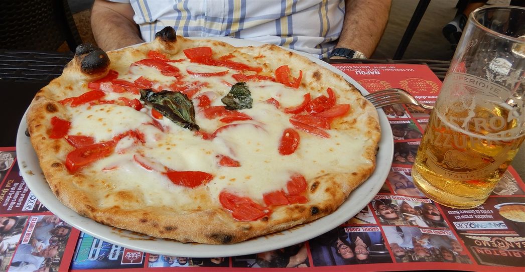 'Pizza Margherita DOP', made with tomato, buffalo mozzarella from Campania, basil and extra virgin olive oil. 'Pizzeria Dal Presidente' in Via dei Tribunali.