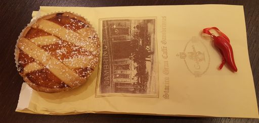 Pastiera today can be small and be eaten as a street food.  This is a pastiera from Gran Cafe Gambrinus.