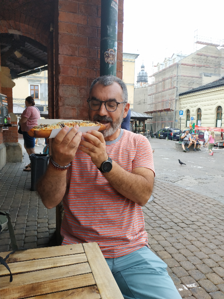 Me enjoying a zapiekanka at Plac Nowy.