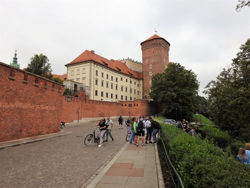 Wawel Castle from the south.  The tower is Baszta Senatorska. In the foreground is the road that leads to the entrance of the hill complex.