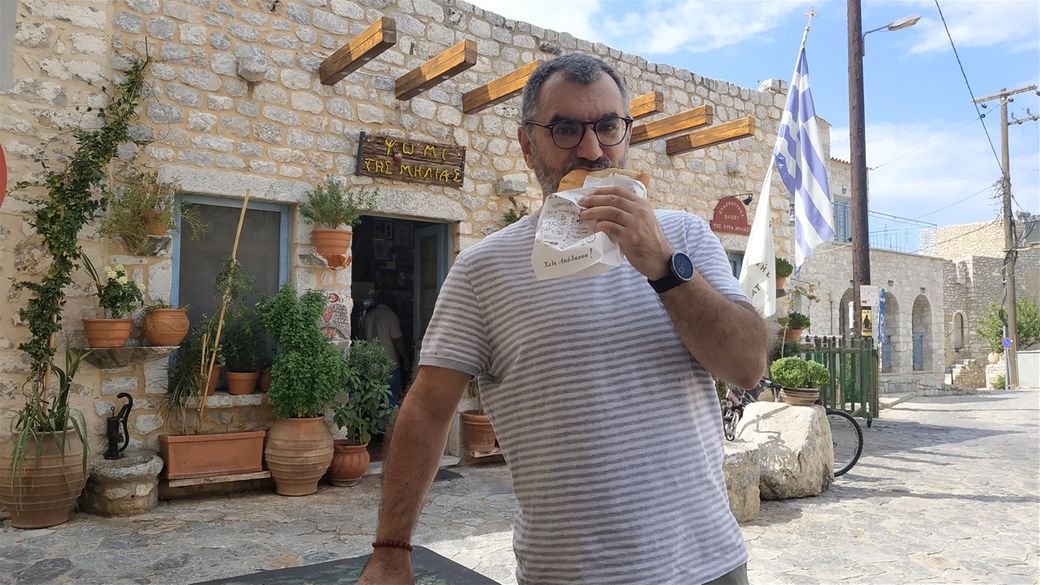 Me eating a delicious travychti from Milia's bakery.
