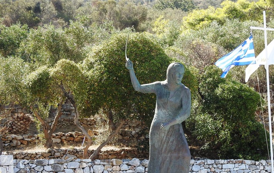 The memorial statue of the Woman of Mani located close to the entrance of Diros caves.  The women of Mani fought the Turks in the Battle of Diros in 1826 by any available means they had, such as sickles, stones and thistles. This is one of the most heroic aspects of modern Greek history.