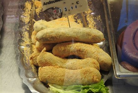 Andouillette sold in an open air market outside Perache train station in Lyon.
