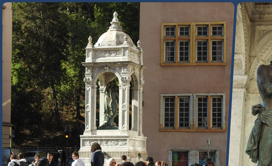 The fountain in the middle of Place Saint Jean, featuring a sculpture of Saint John the Baptist .