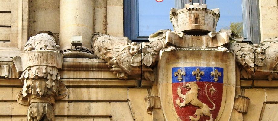 The city of Lyon coat of arms outside a public building.