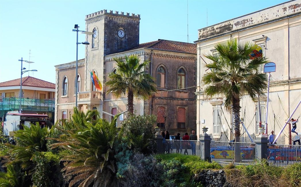 The Aci Castello Town Hall overlooks the castle, located just one block away from Chiesa di San Giuseppe.