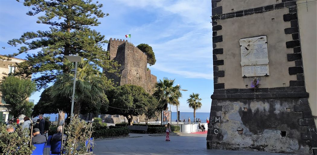 The Piazza Castello and the castle of Aci Castello.