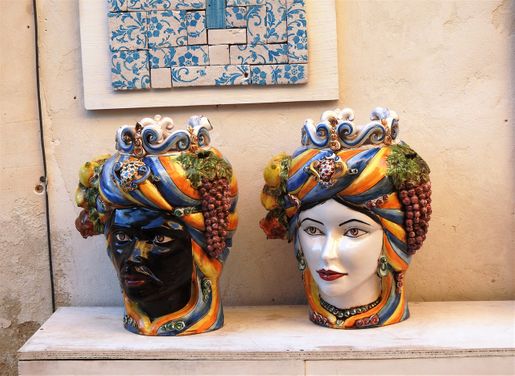 Teste di Moro: the black man and the girl. (Photo taken in the town of Noto.)