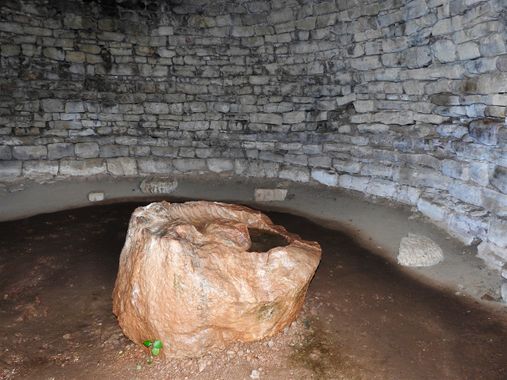 Part of the Roman olive press inside the tomb.