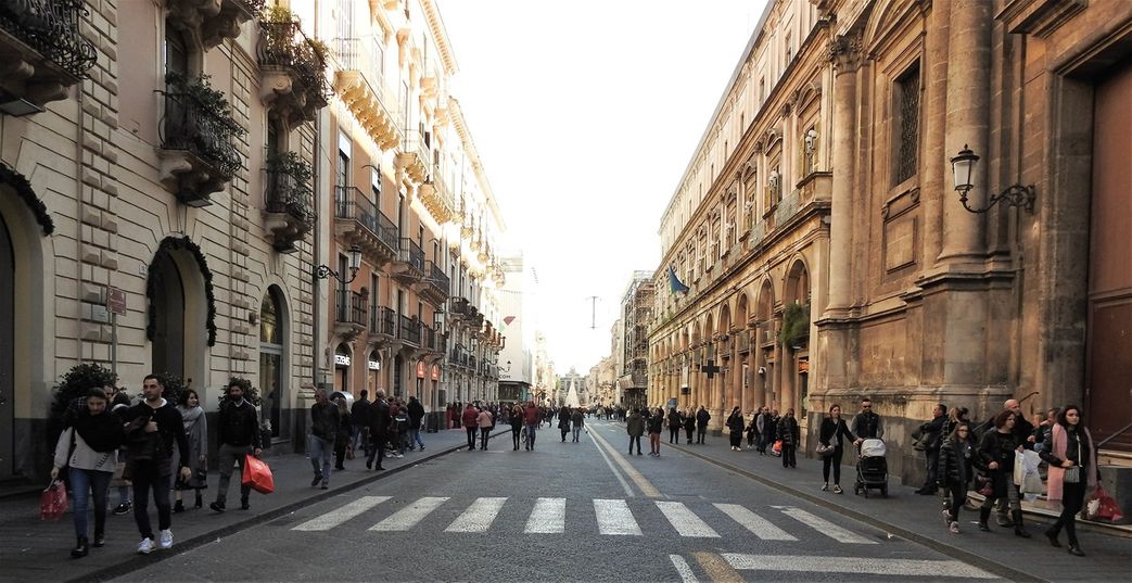Via Etnea towards the south. Palazzo Minoriti and Chiesa di San Michele ai Minoriti on the right of the road.