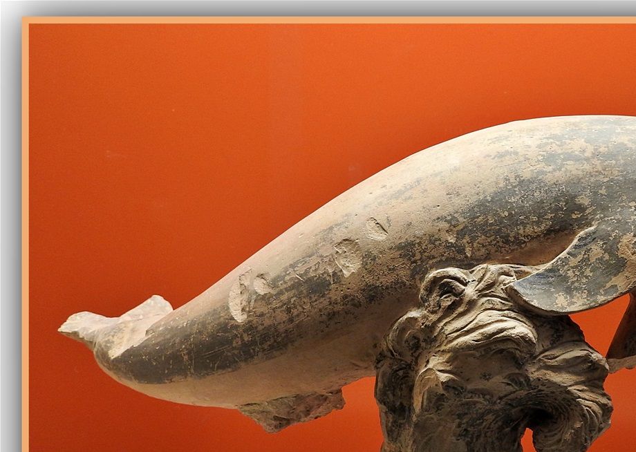 A dolfin made of terracotta.