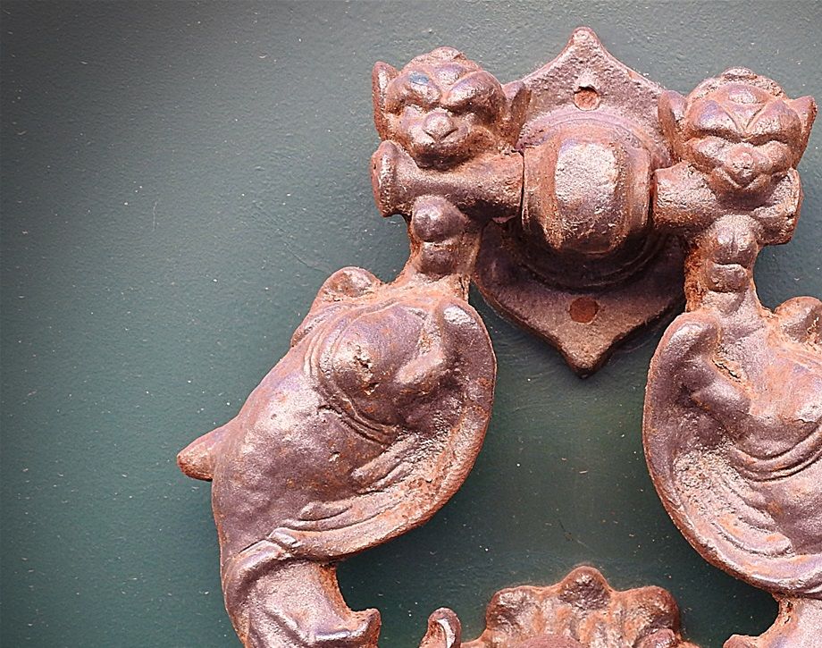 The knocker on the door of the building on No53 of Via Camillo Benso Conte di Cavour.