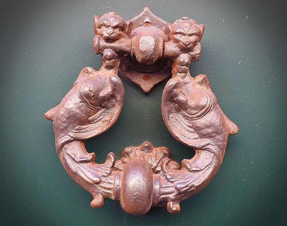 The knocker on the door of the building on No53 of Via Camillo Benso Conte di Cavour.