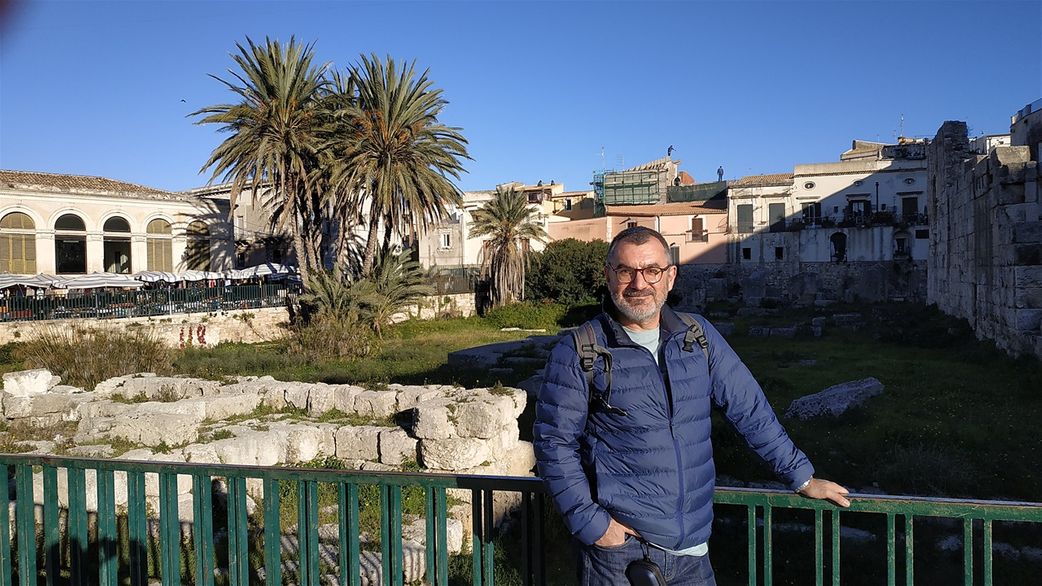 Me in front of the Temple of Apollo. The Old market can be seen on the left.