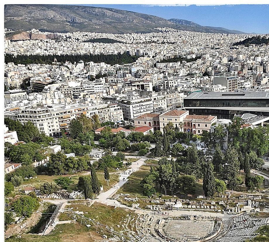 The Theater of Dionysus and the Acropolis museum seen from the sacred rock.
