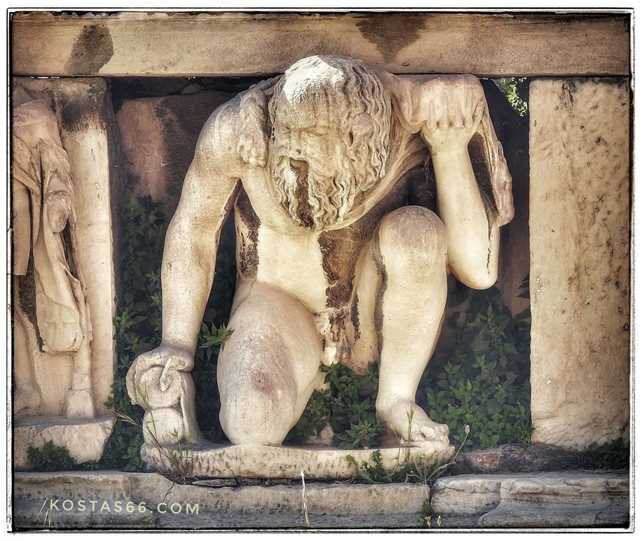 Theatre of Dionysus Eleuthereus. Statue of a kneeling satyr from the Roman stage building.