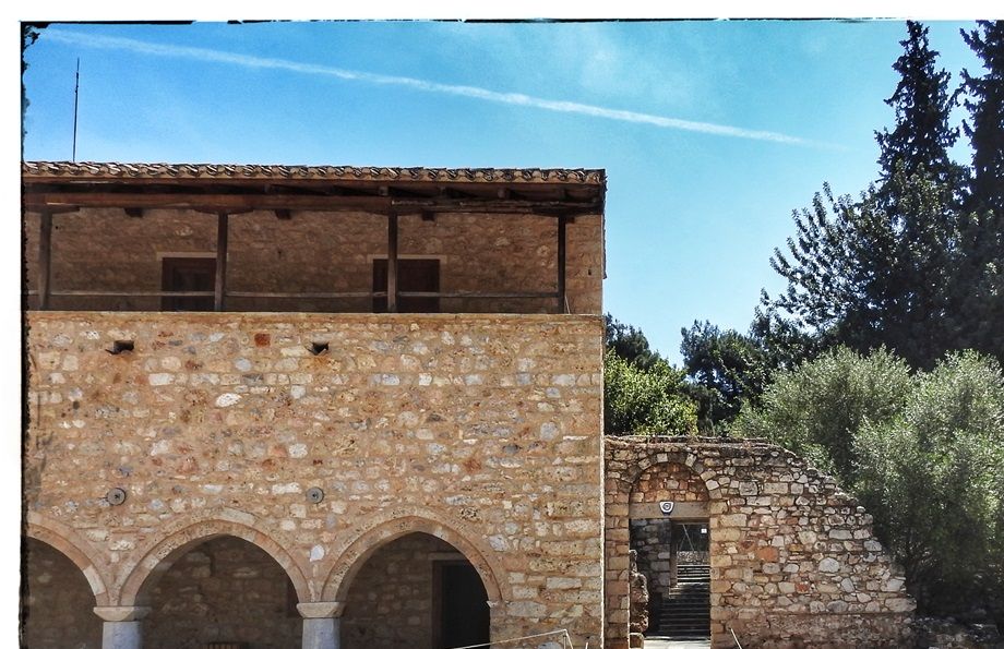 The refectory (on the left) is the first building after the entrance to the monastery (right).