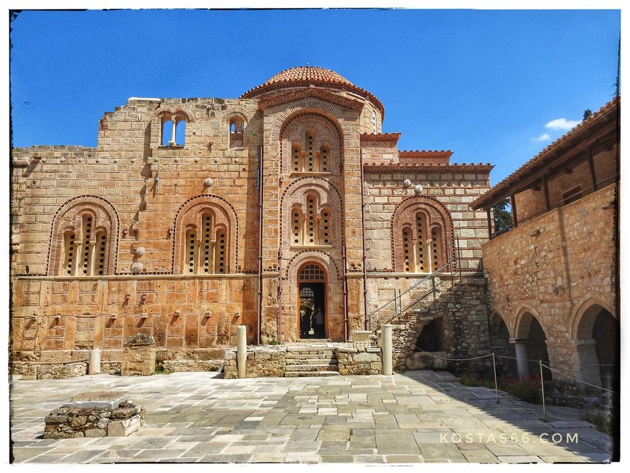 The south side of the catholicon.  The building on the right is the refectory.