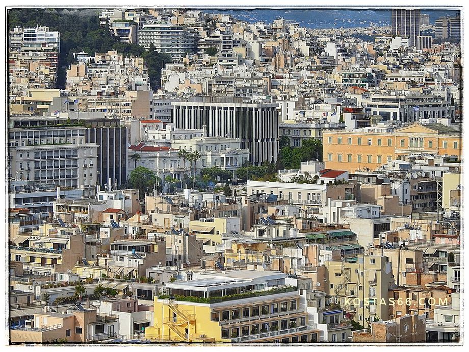 (north-east of the sacred rock). The Greek Parliament (the yellow building on the middle-right).