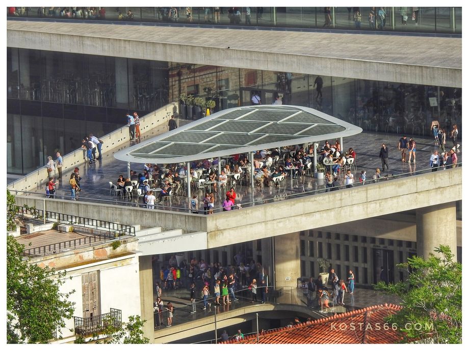 (south of the sacred rock): The Acropolis Museum.