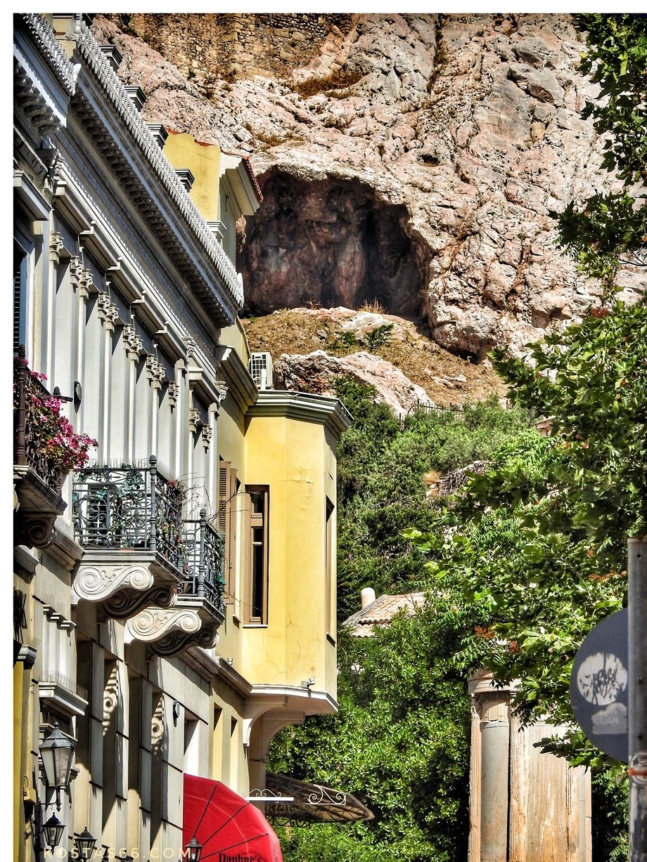 The Sanctuary of Aglauros is inside the largest cave in the city of Athens.  Picture taken from the Hadrian's Arch, located at some distance to the east.