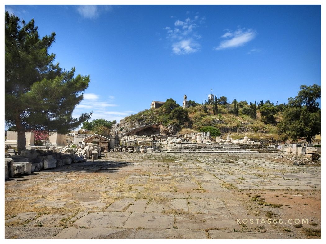 Τhe Roman court of the archealogical site seen from ticket booth (the entrance). At the background we see the Greater (big) Propylaea, probably built by Marcus Aurelius, and at the back the Acropolis with the Panagitsa chapel, Clock and Bell tower on it.