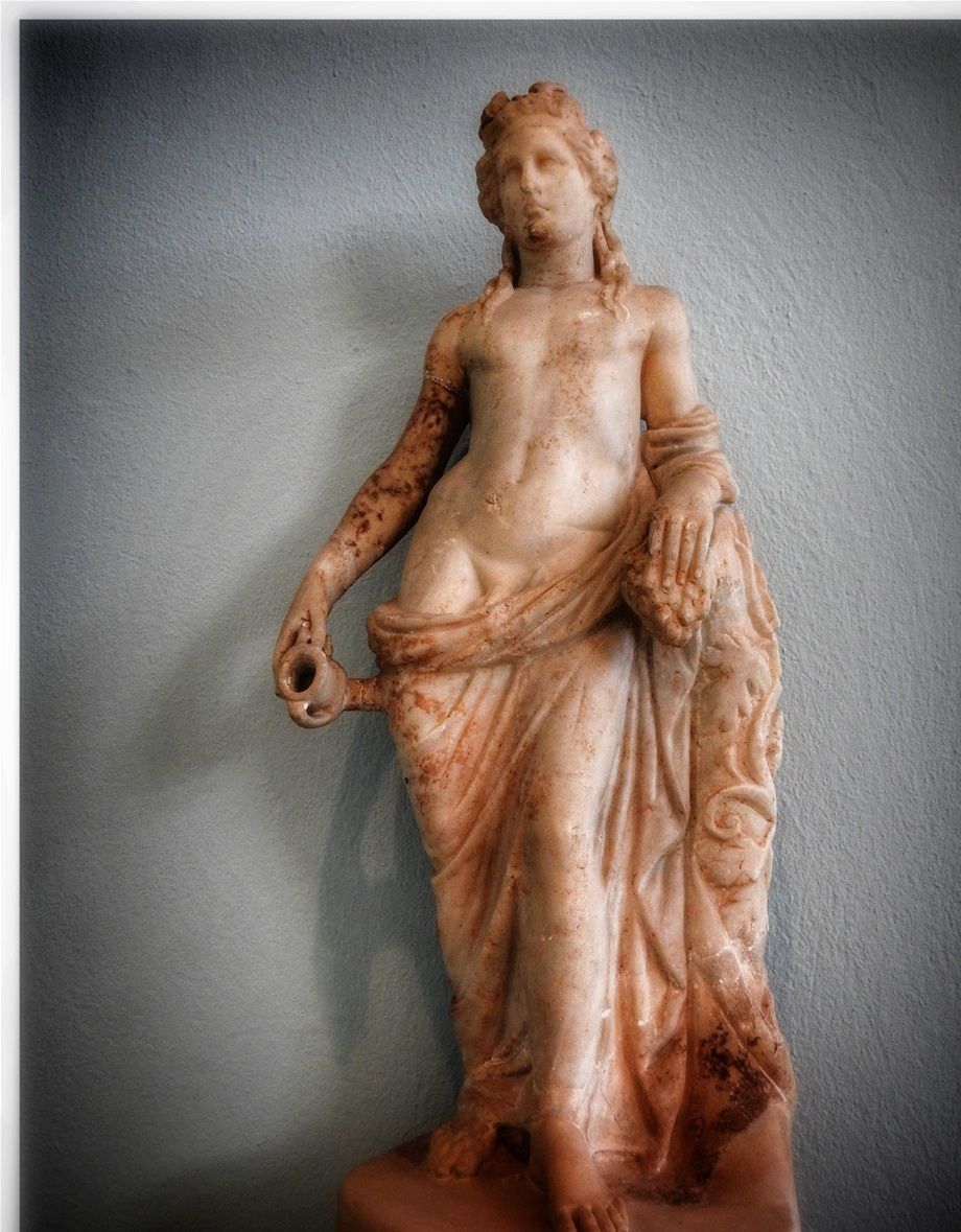 Dionysos, Roman Age smaller statue. The right hand holds kantharos for drinking wine. Clading is almost like Aphrodite Anadyomene.