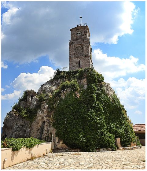 The clock tower of Arachova.  The clock is located at the backyard of the Folklore Museum of Arachova, and irs access is through the museum gates.