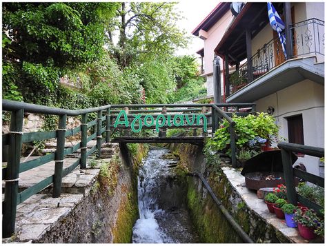 The stream running from the waterfalls to the central square of Agoriani.