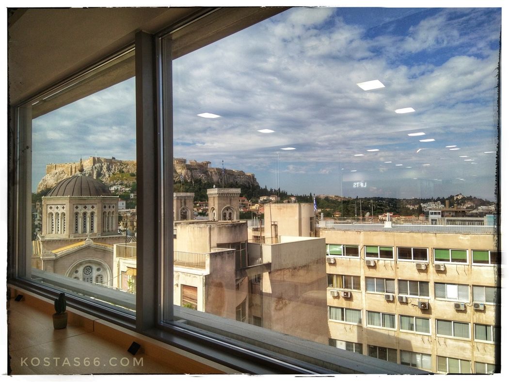 The SE side of the Acropolis seen from the cafe of the Marks & Spencer store on Ermou street.