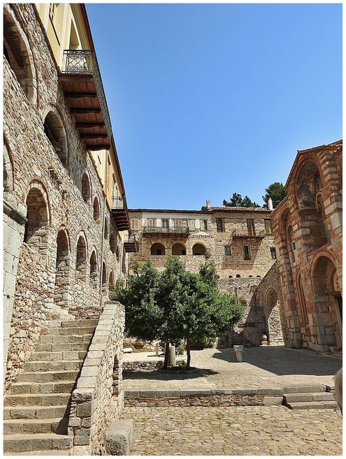 The main courtyard inside the walls. The west cells wing is on the left, the north cells wing at the background and the Katholikon on the right of the picture.