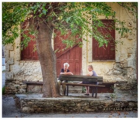 Ladies sitting outside the old convenience store.