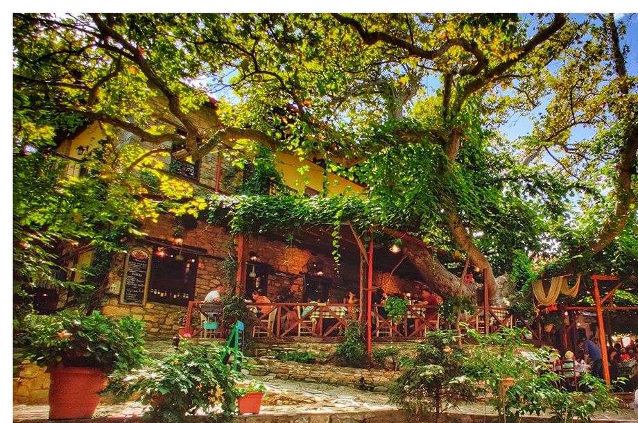 One of the many restaurants on the main square Palaios Panteleimon.