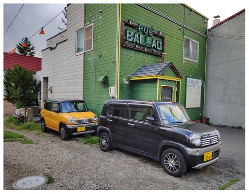 Super-cute kei cars outside a pub in Jozankei Onsen.