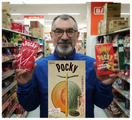Me with Pocky in both hands and a Yubari melon Pocky on my chest...