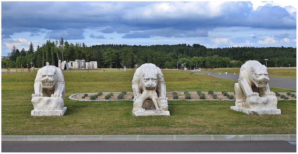 Gargoyles opposite the Hill of Buddha and the Stonehenge at the background.