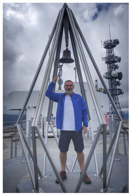 Rinking the Bell of Happiness atop the summit observation deck of Mount Moiwa.