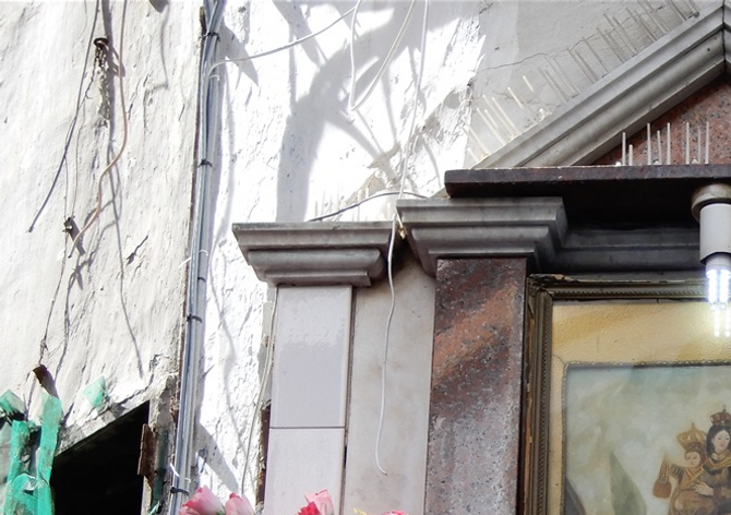 The devout build shrines to the Madonna. In the old neighborhoods, in every corner of the street, there is a shrine devoted to Virgin Mary, Christ or to a saint.  Some times the shrine consists of only a humble icon and other times it is a lush fully lit construction that resembles like a small hanging temple.
