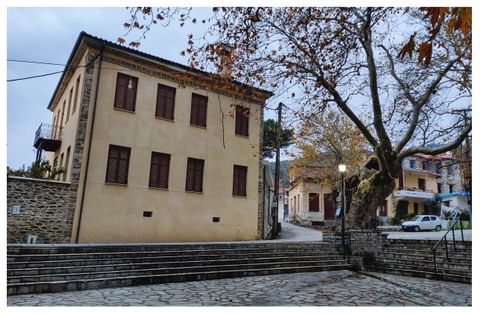 The Vatzia mansion built in 1871 and the big plane tree at the village square.