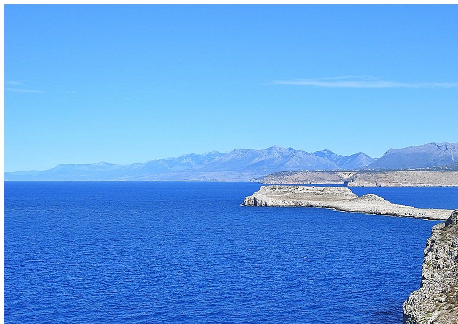 From Panagia Odigitria courtyard the view towards Cape Tigani is marvelous.
