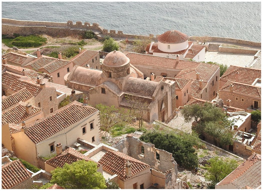 The Church of Agios Nikolaos is seen from the higher neighborhoods of the Lower Town. Panagia Chrysafitissa stands behind Agios Nikolaos..