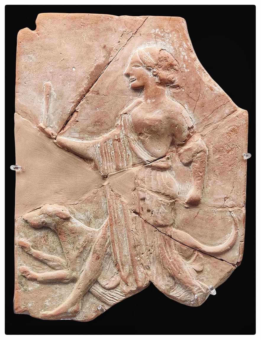 Artemis hunting with her dog.