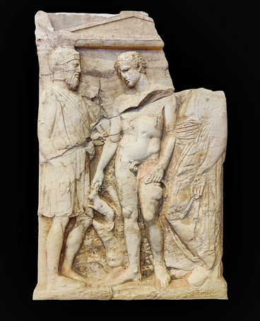 GRAVE STELE. Pentelic marble.  Porto Rafti (Drivlia). 410-400 B.C.  Attic grave stele surmounted by a relief pediment supported by pilasters. The names Kloeboulos and Menon are incised on the pediment. There are three fig ures depicted in the scene. The beardless young man in the middle is depicted as a palaestretes (an athlete) holding a strigil and an aryballos. He is accompa nied by his dog while in the other hand he a small rabbit. The figure standing on the right of the youth is a bearded warrior with an attic helmet on his head, a shield and a spear in his left hand and a sword hanging from the telamon. Kleobolos and Menon are the youth's and the warrior's names respectively. On the left of the youth stands an old man wearing a himation, possibly Kleoboulos' father.  The stele is interesting in terms of architectural form, composition and ico nography. Both young Kleoboulos, the main figure of the scene and the beard ed Menon with his full warlike appearance are dead. Menon, could be identified with Menon the trierarchos (official of the Athenian Navy), whose name is to be found in a casualty list dated by the end of the Peloponnesian War. The death of young Kleoboulos was the reason for the erection of the stele on which his relative Menon, already killed in the battle, was also depicted.  The lower part of the stele was found in 1961/2 at Drivlia, Porto Rafti and in 1963 it was handed over to the museum of Brauron. The upper part of the stele was smuggled and was sent abroad. In 1990 it was published in the catalogue of the Shelby White and Leon Levy Collection of the Metropolitan Museum of Art in New York and became widely known. After its identification by professor Georgios Despinis the repatriation procedure began and it was completed on August 1st, 2008.