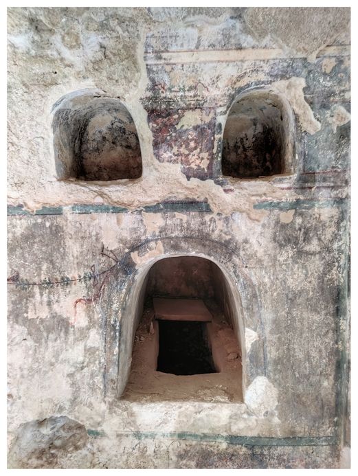 Loculi and niches inside a tomb at the Roman Necropolis of Kechries.